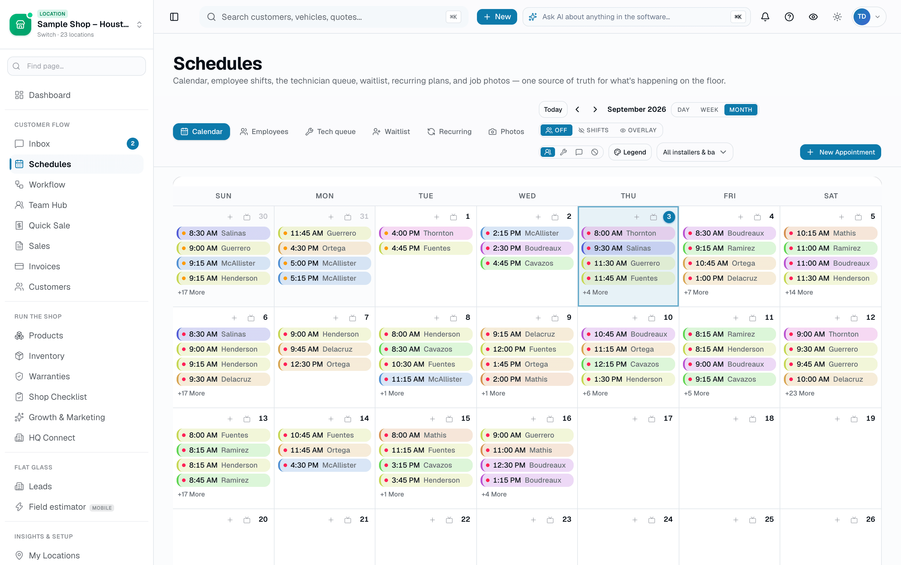 A real month at a packed shop — resource-colored appointments with one-tap Book and Sales Matrix entry on every day.